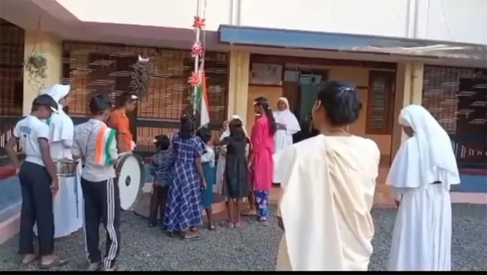 Students are involved in a flag-related activity within the school premises.
The image shows active participation and collective effort.
It reflects national pride and inclusive celebration.