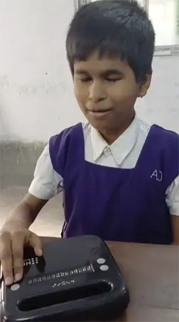 A student is seen reading or interacting with a Braille device.
The image highlights independent learning through assistive technology.
It reflects the importance of Braille literacy and accessible education.