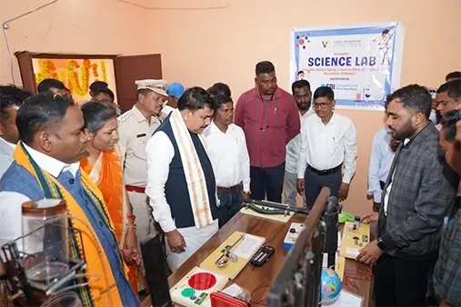 The minister viewing the various instruments and objects at the Accessible Science Lab.