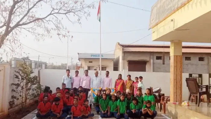 Students and teachers are gathered outdoors for a group photograph.
The image reflects a school-wide activity or celebration.
It highlights togetherness and inclusive participation.