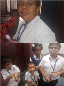 This image is of students from Rahmaniya School, Calicut, Kerala, where students can be seen smiling and holding chocolates courtesy VE