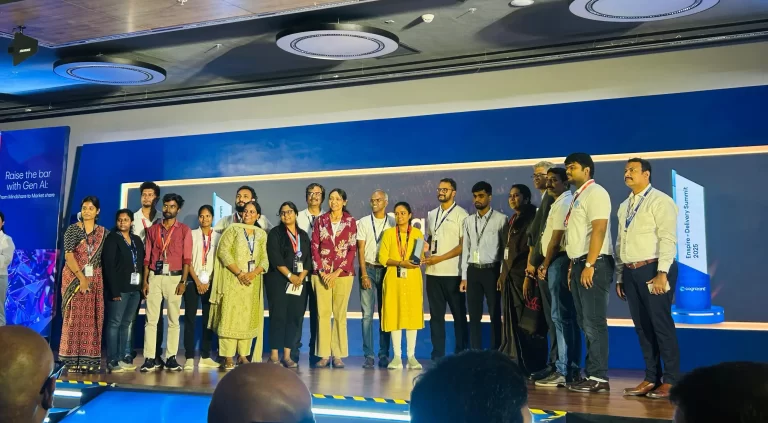 Cognizant Foundation and Cognizant Outreach stall team members receiving a Special Award at the summit, where they are all standing together on the stage for a photo with the award
