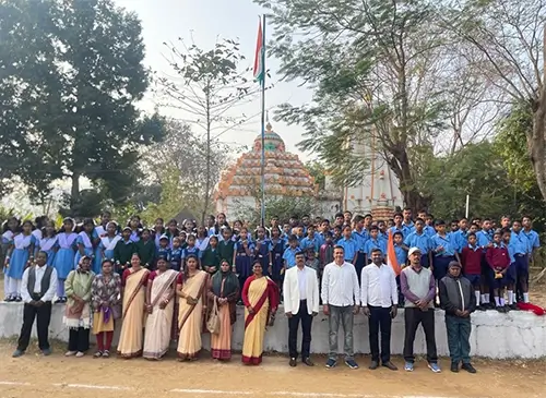 Students, teachers, and guests are assembled for a formal group photograph.
The gathering suggests a school event or special occasion.
It highlights community participation and shared celebration.