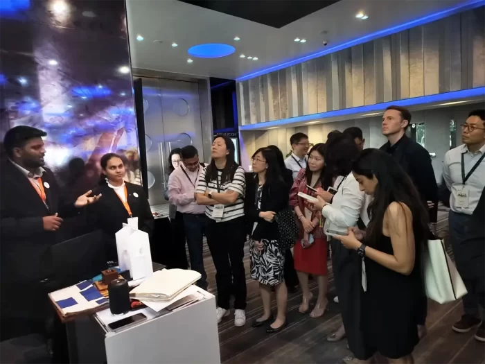 Participants at the event, listening to team at a VE station