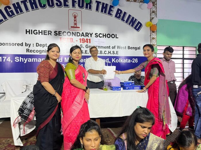 VE teachers Bipasha, Moupriya, and Shantana felicitating principal Mr. Amiya, Lighthouse for the Blind