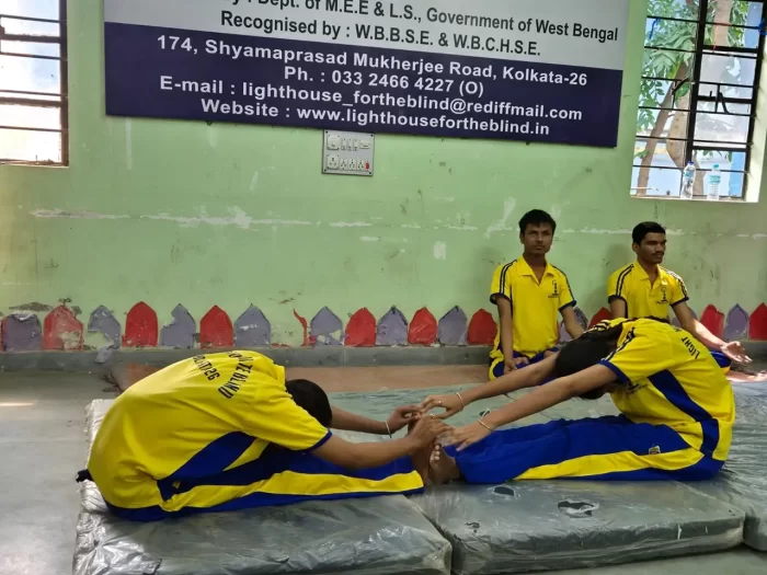 Four students doing yoga poses